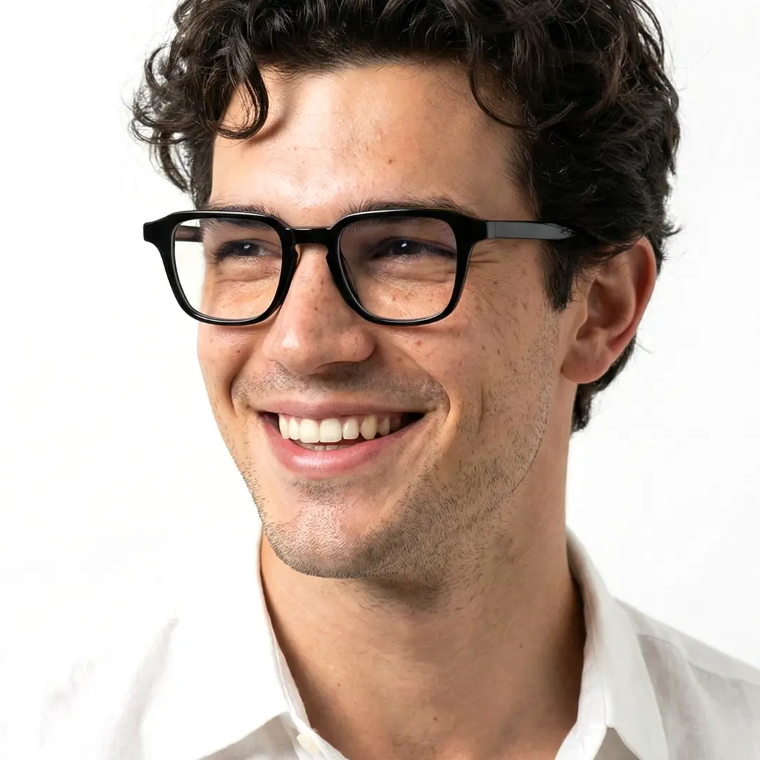 Three-quarter view of male wearing vintage black rectangle eyeglasses, wide smile, EA0122509