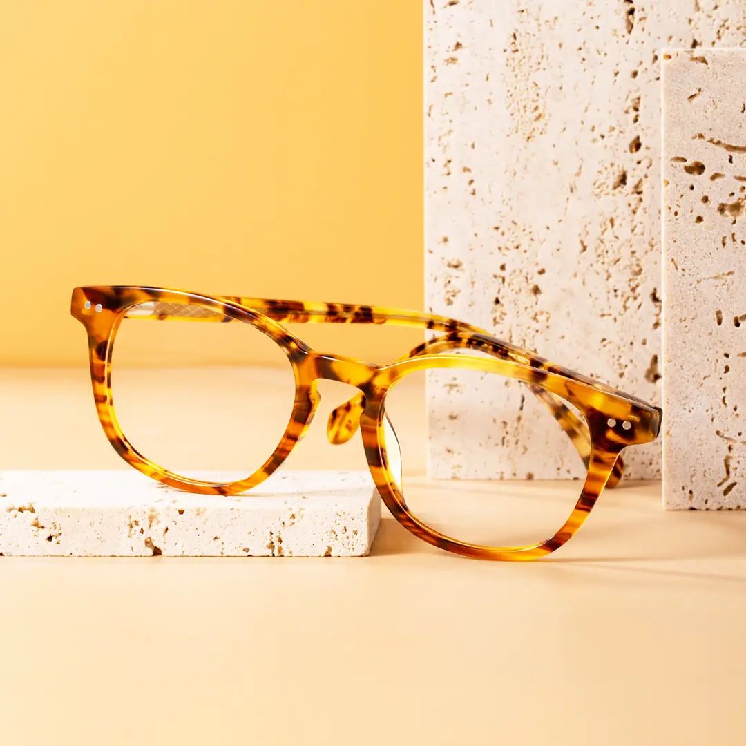 Scene close-up view of Delia colorful style rectangle acetate eyeglasses EA0142209 in tortoise
