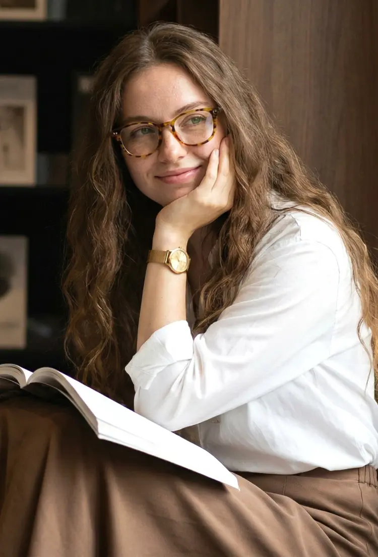 Female model wearing colorful tortoise rectangle acetate eyeglasses in a private library. SPU: EA0142209