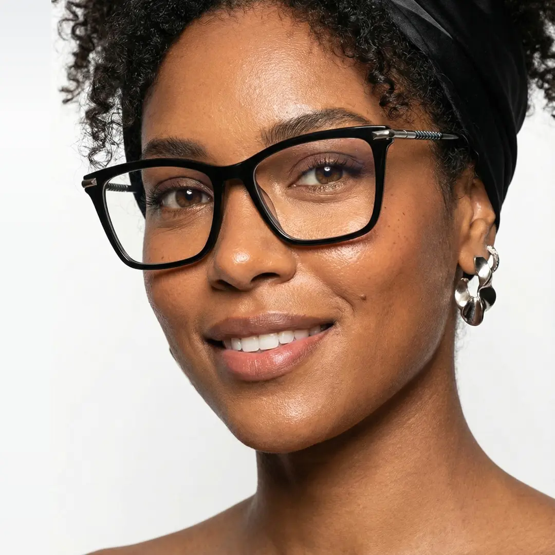 Face close-up view of female wearing black rectangle eyeglasses, natural smile, EA0252509