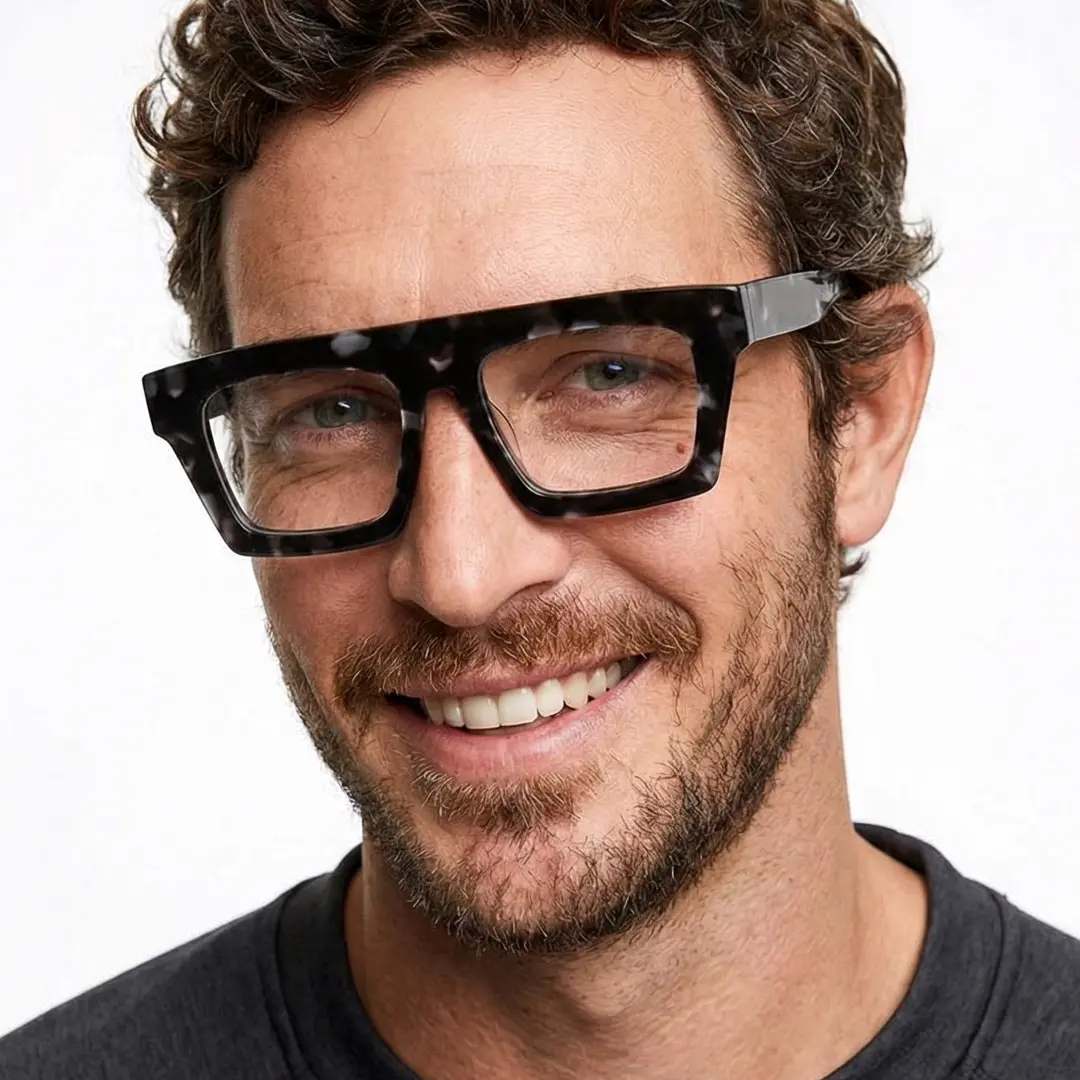 Front view of male wearing black rectangle eyeglasses, smiling, EA0442508
