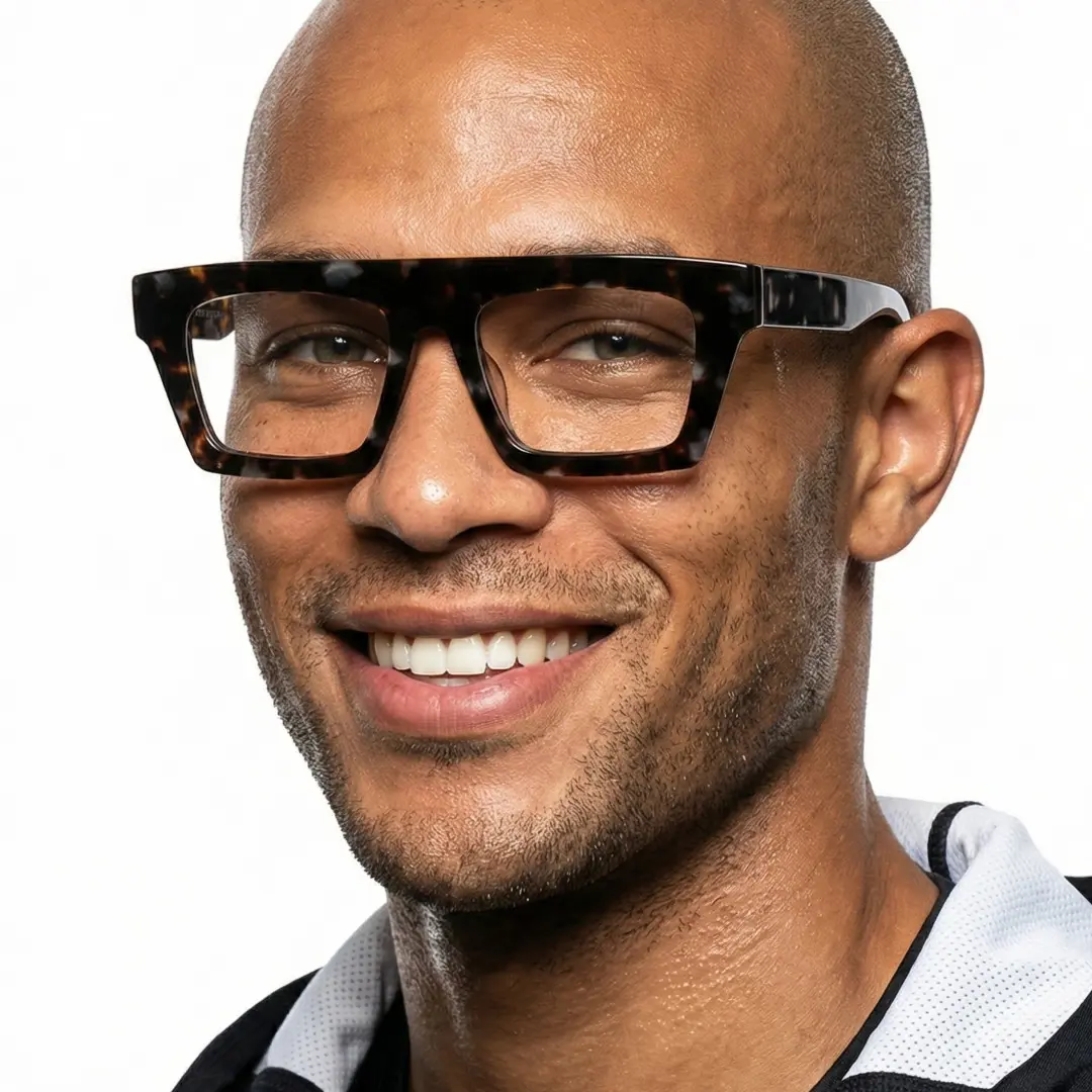 Three-quarter view of male wearing black rectangle eyeglasses, smiling, EA0442508