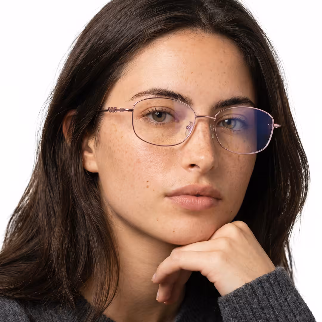 Female wearing purple rectangle metal eyeglasses, natural expression while resting chin on hand. SPU: EM0062604