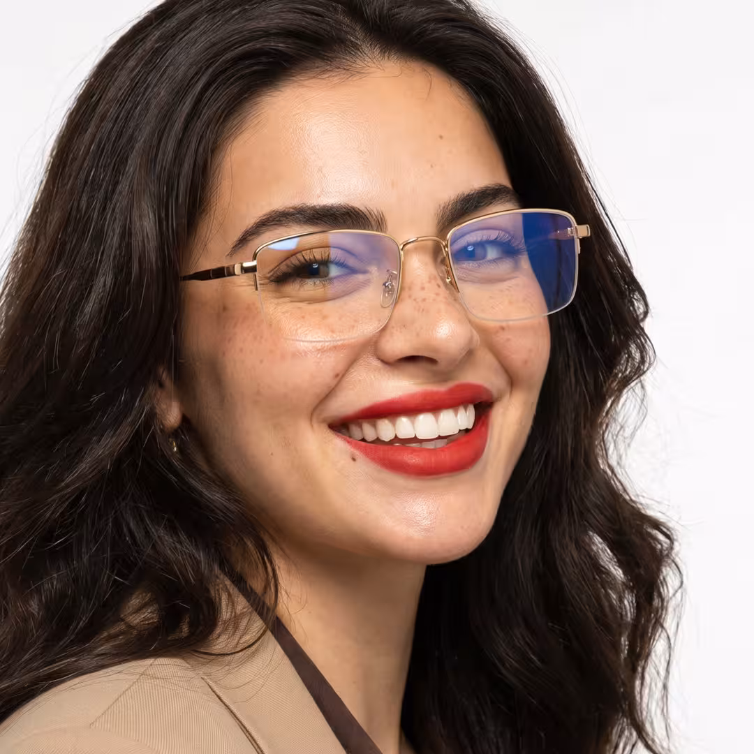 Three-quarter view of female wearing office siren gold rectangle eyeglasses, smiling, EM0192605