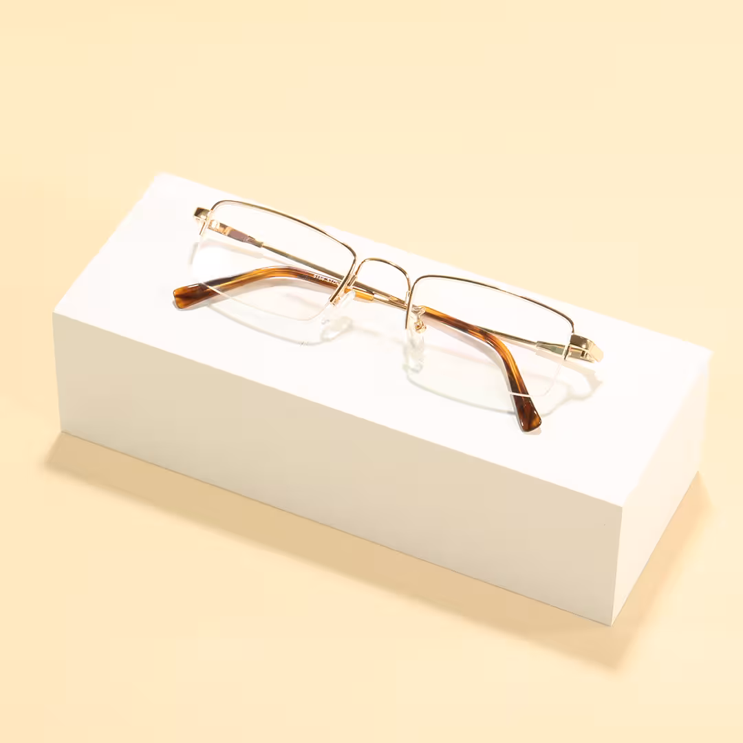 Scene close-up view of Liorn office siren rectangle metal eyeglasses EM0192605 in gold