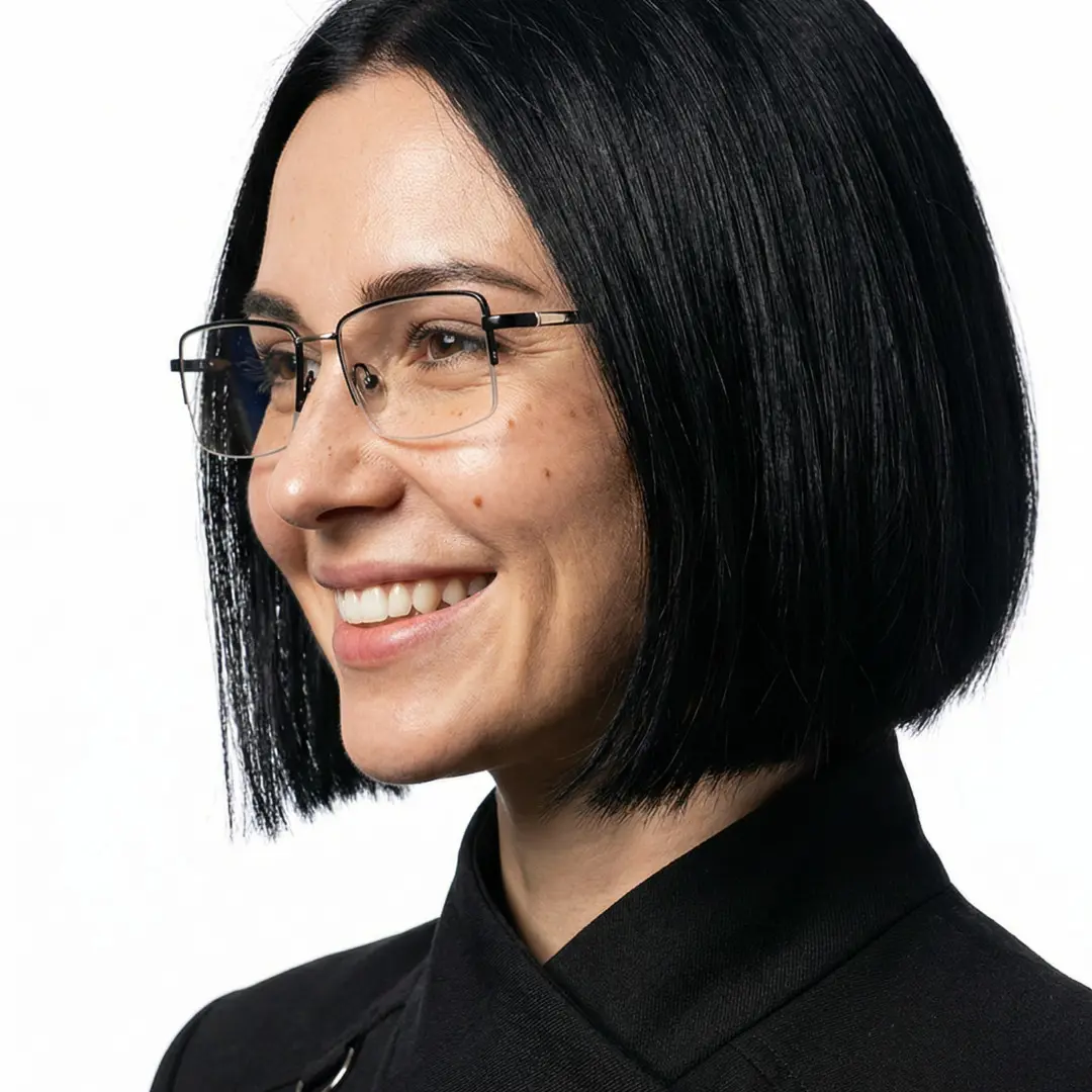 Looking away view of female wearing black rectangle eyeglasses, natural smile, EM0252508