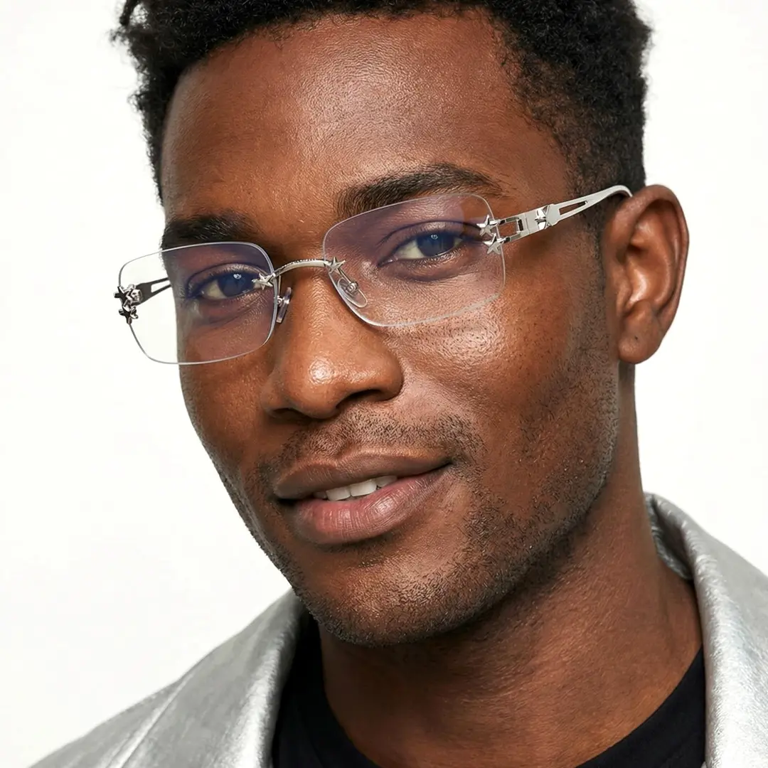 Three-quarter view of male wearing y2k silver rectangle eyeglasses, smiling, EM0302512