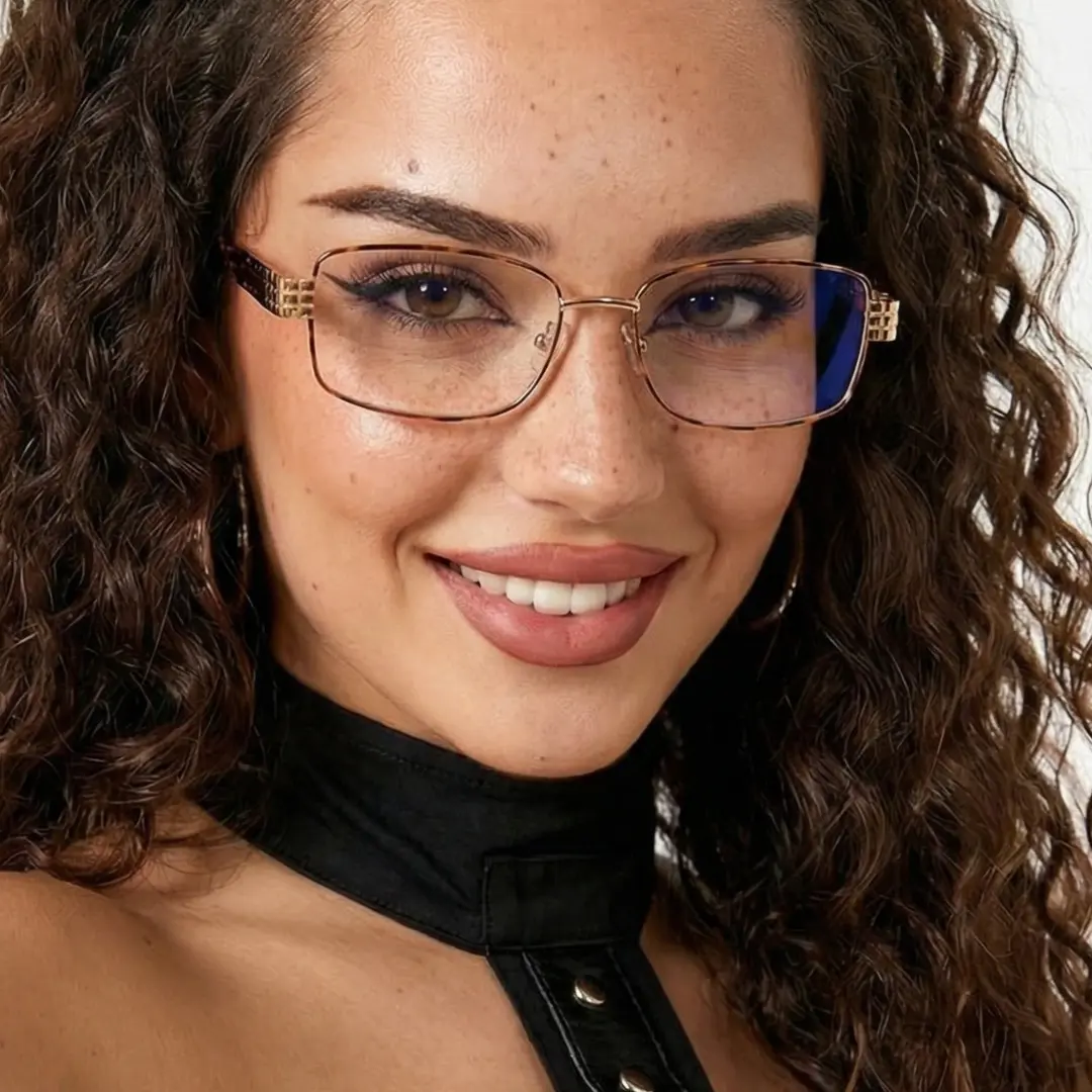 Three-quarter view of female wearing office siren tortoise rectangle eyeglasses, smiling, EM0322508