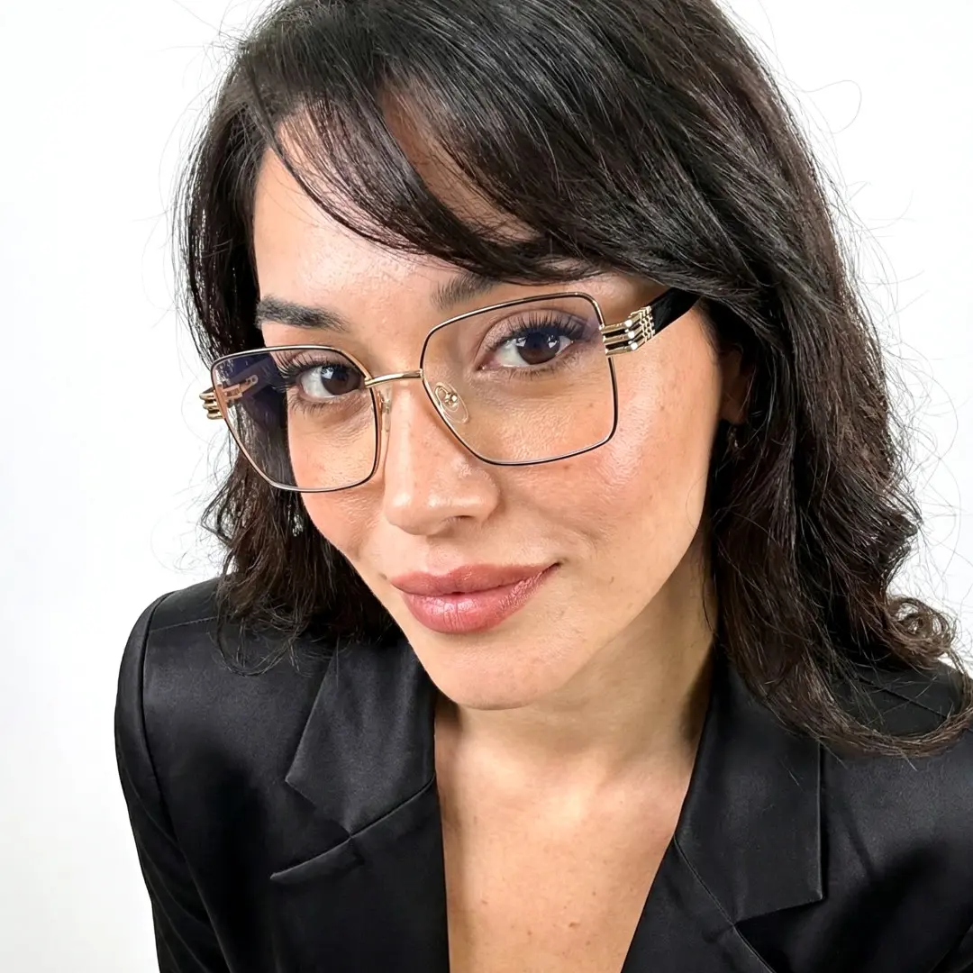 Close-up view of male wearing black rectangle eyeglasses, natural smile, EM0332508