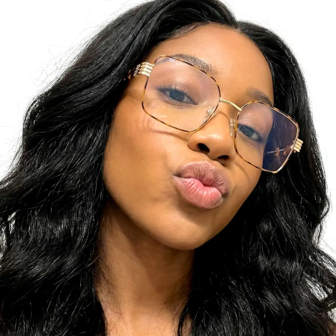 Profile view of female wearing tortoise rectangle eyeglasses, pouting, EM0332508