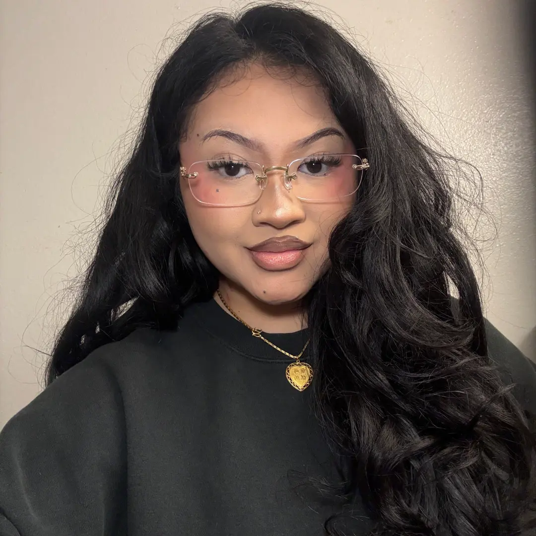 Slightly angled view of female wearing office siren silver rectangle eyeglasses, natural smile, EM0352412