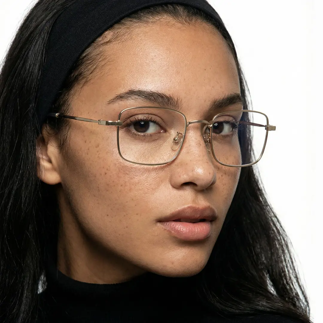 Profile view of female wearing y2k silver rectangle eyeglasses, neutral expression, EM0372412