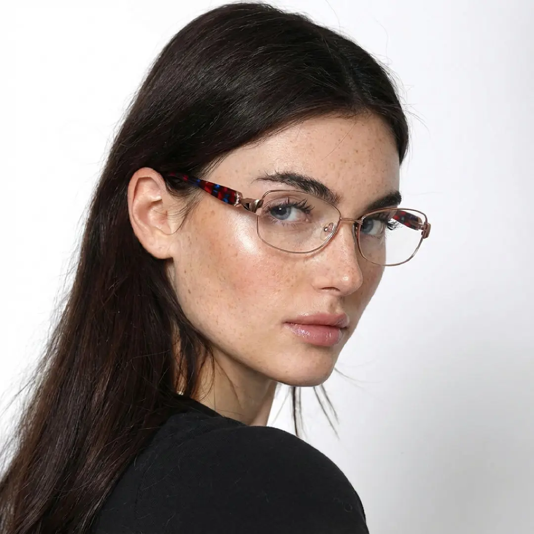 Female wearing office siren brown rectangle metal eyeglasses, natural expression. SPU: EM0482509