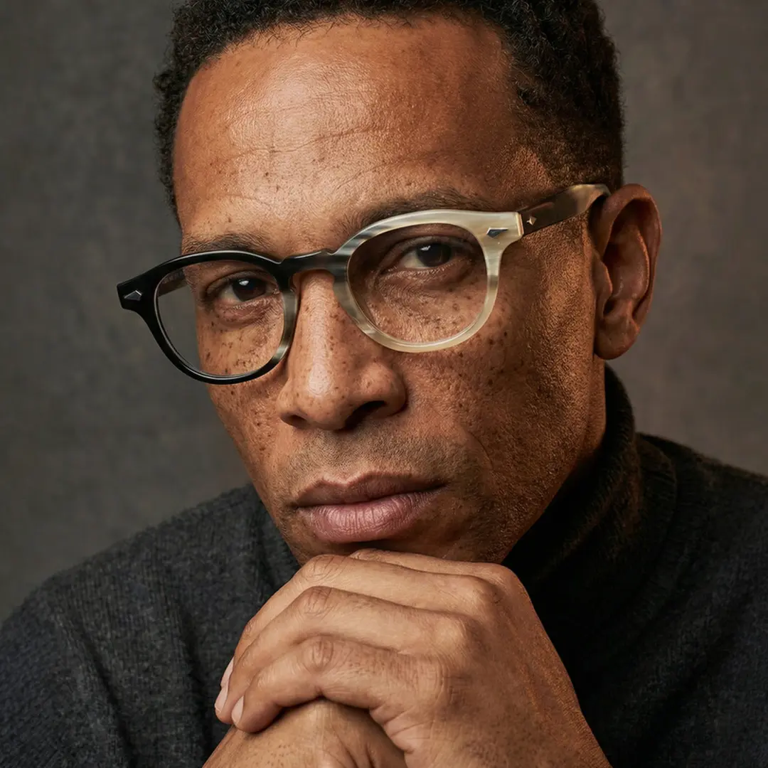 Three-quarter view of male wearing two tone rectangle eyeglasses, natural expression, EO0252511