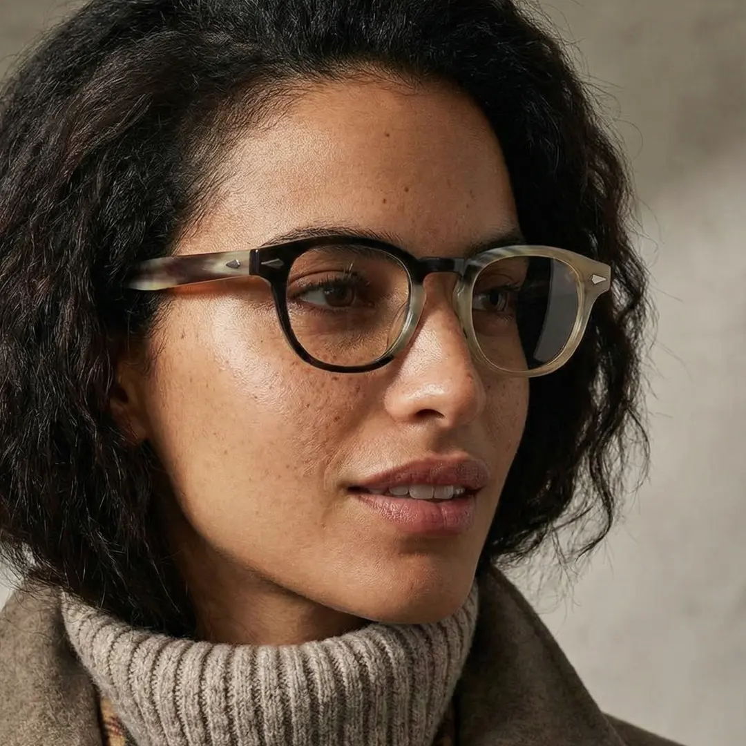 Looking away view of female wearing two tone rectangle eyeglasses, neutral expression, EO0252511