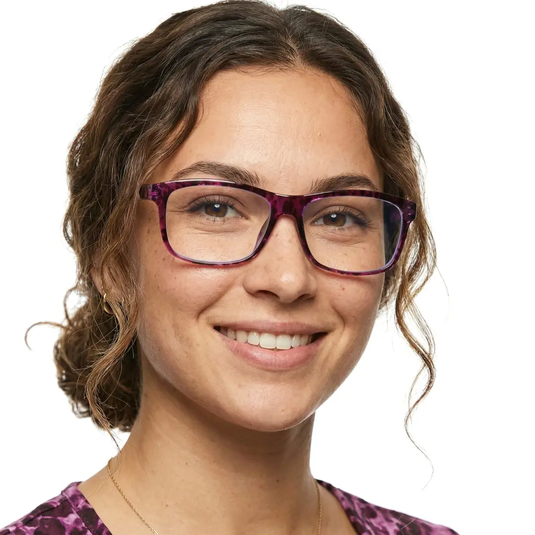 Slightly angled view of female wearing red tortoise rectangle eyeglasses, smiling, EP0032410
