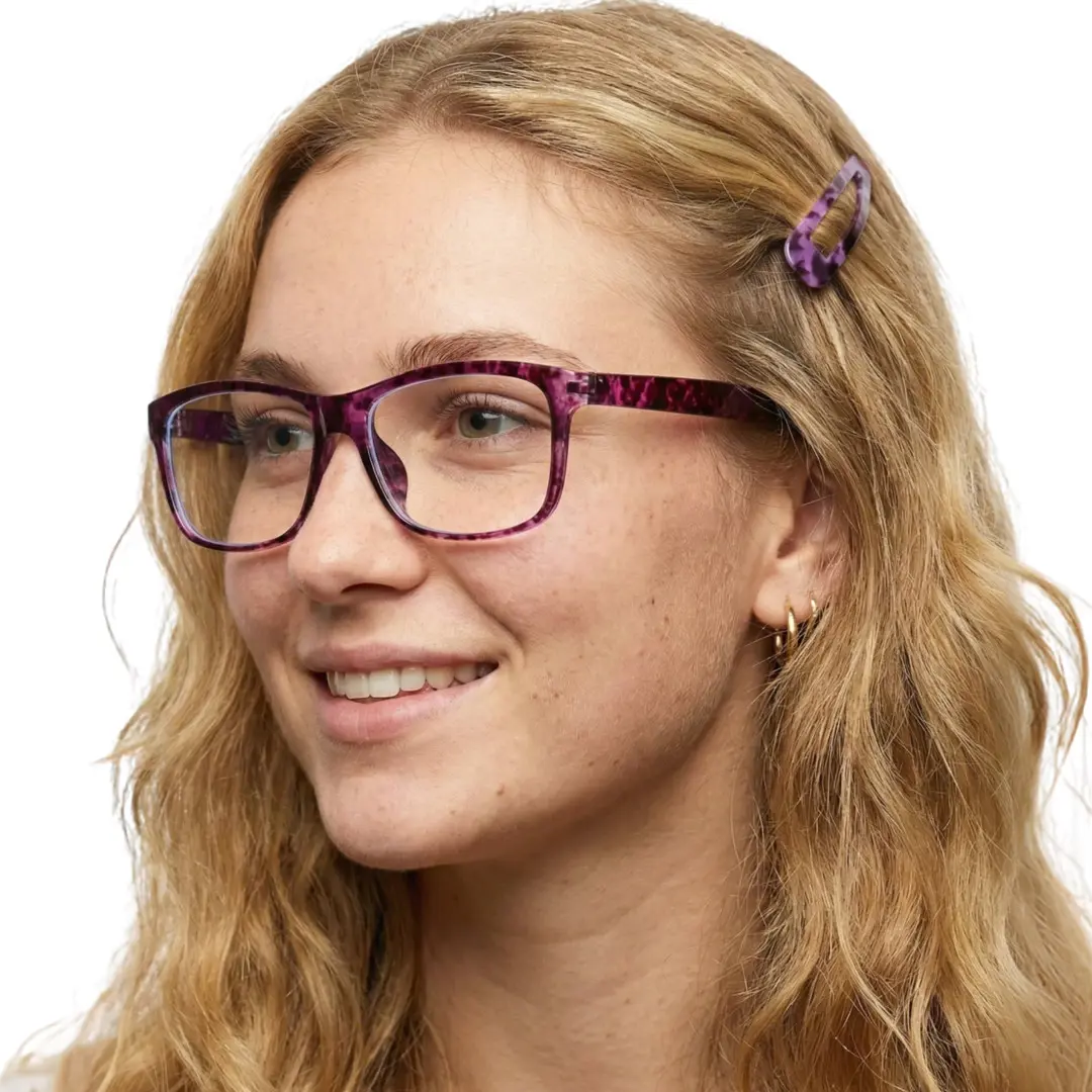 Three-quarter view of female wearing red tortoise rectangle eyeglasses, natural smile, EP0032410