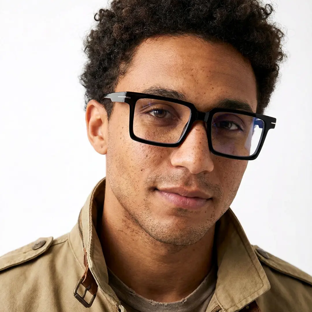 Slightly angled view of male wearing black rectangle eyeglasses, calm expression, EP0102508