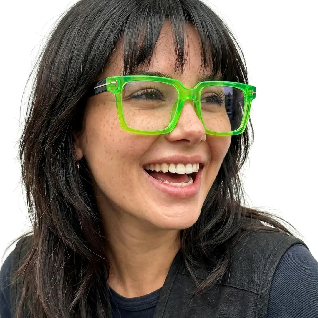 Three-quarter view of female wearing green rectangle eyeglasses, open mouth, big smile, EP0102508