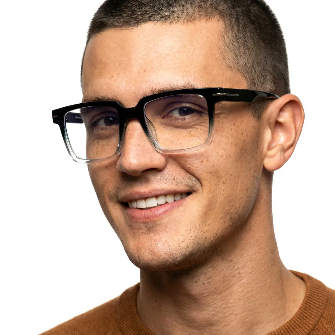 Face close-up view of male wearing two tone rectangle eyeglasses, friendly smile, EP0102508