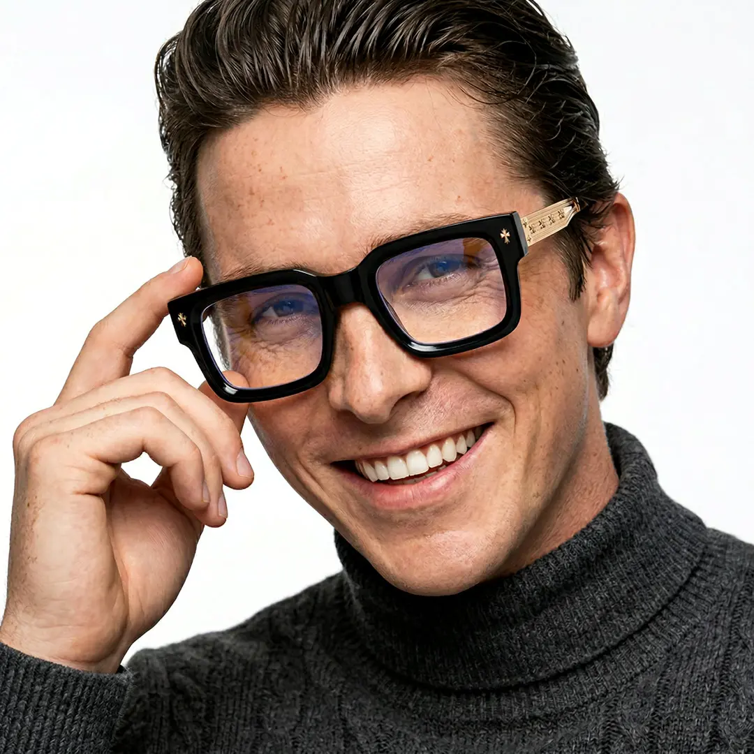 Three-quarter view of male wearing gold rectangle eyeglasses, adjusting glasses, smiling, EP0202603