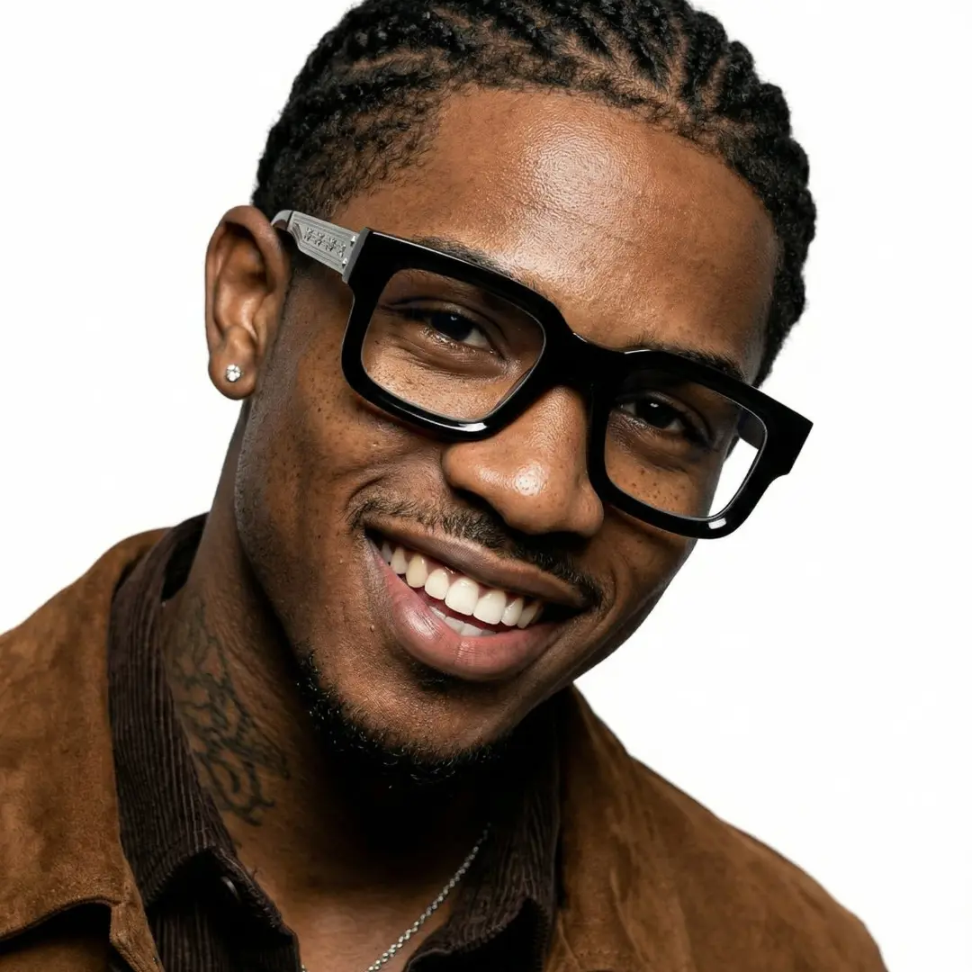 Tilted head view of male wearing silver rectangle eyeglasses, smiling, EP0202603