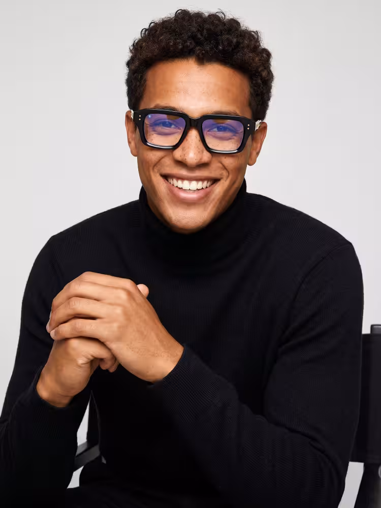 Male model wearing fashion eyewear black rectangle pc eyeglasses in a studio setting. SPU: EP0282508