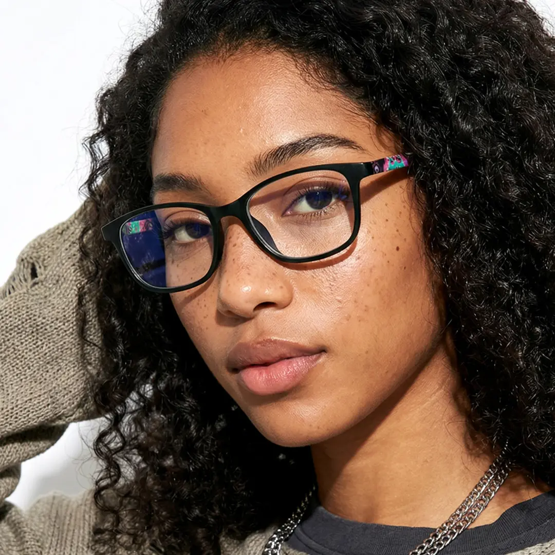 Face close-up view of female wearing green rectangle eyeglasses, neutral expression, EP0312505