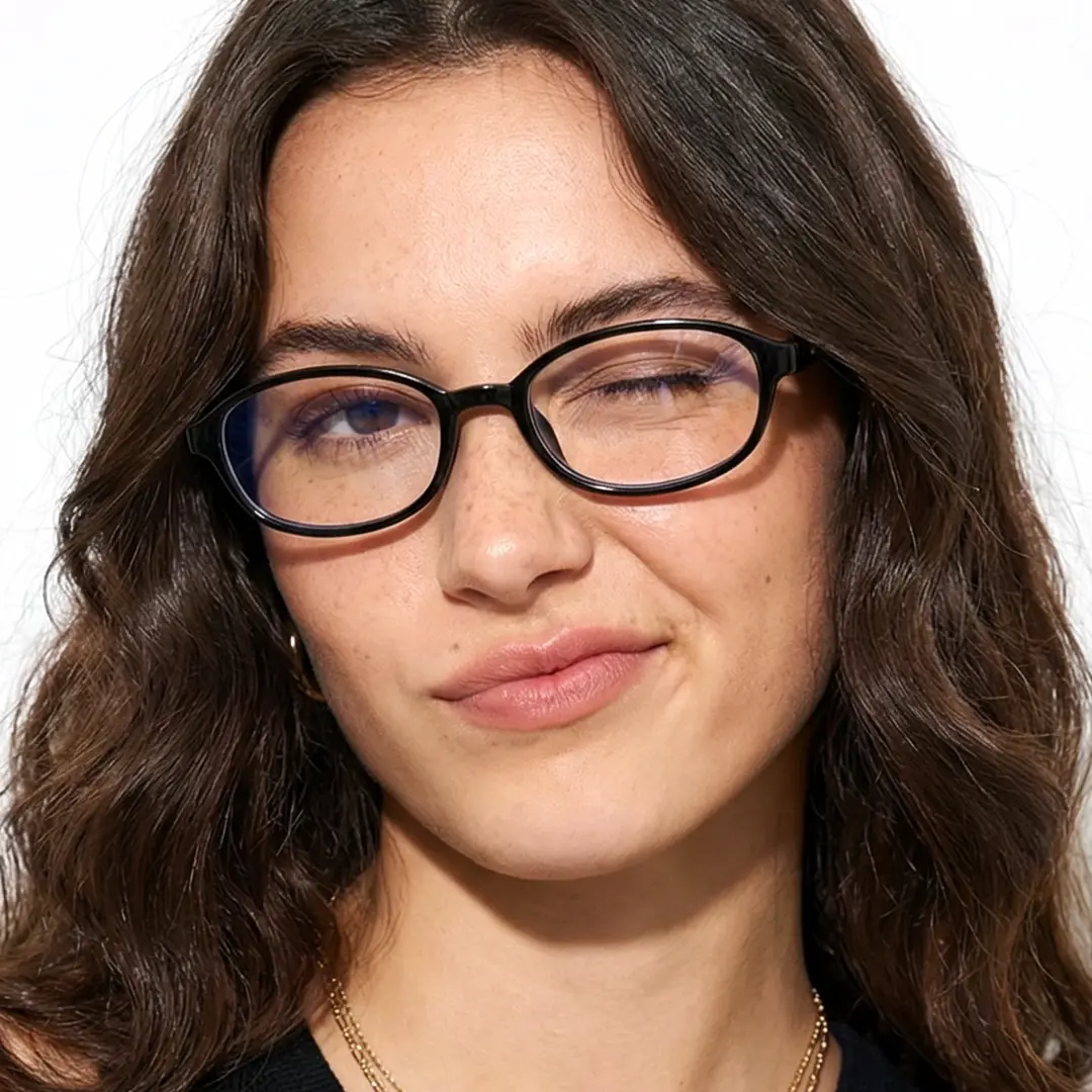 Front view of female wearing black rectangle eyeglasses, relaxed expression, EP0412512