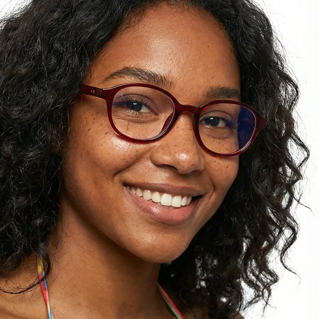 Three-quarter view of female wearing red rectangle eyeglasses, smiling, EP0412512
