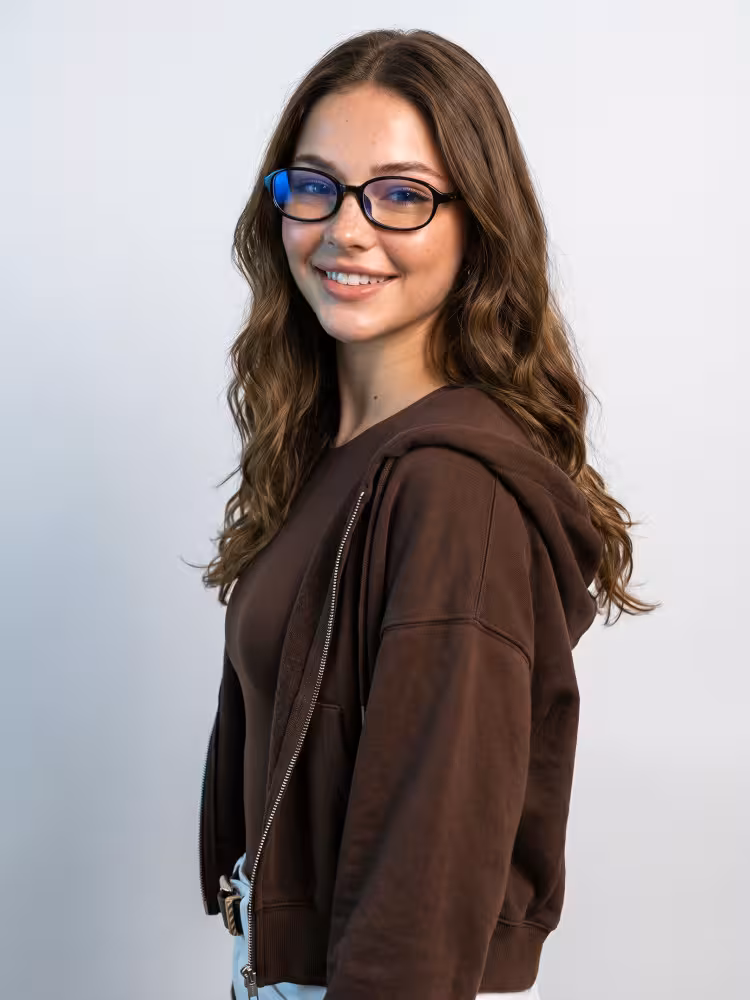 Female model wearing office siren black rectangle pc eyeglasses indoors against a plain white background. SPU: EP0412512