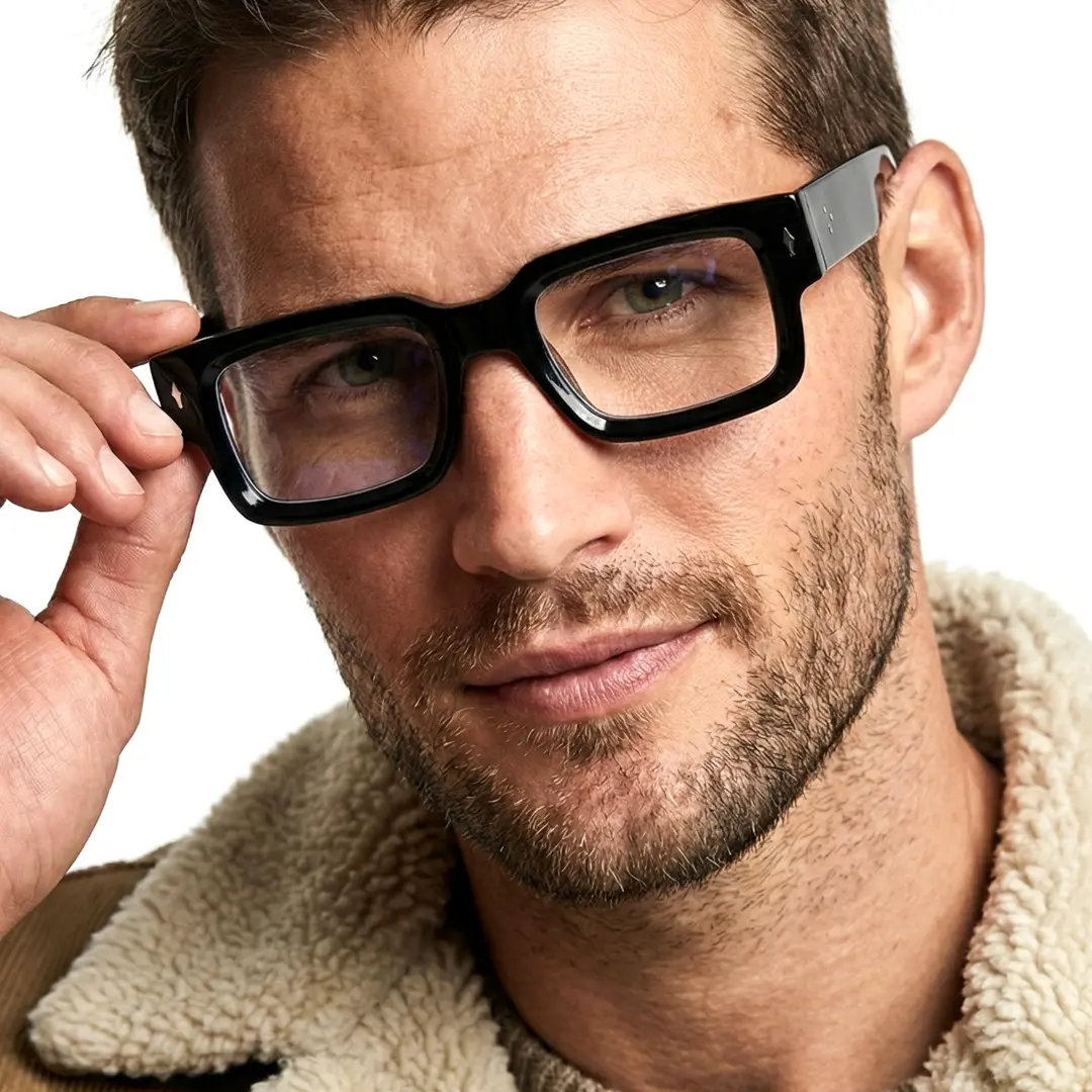 Front view of male wearing fashion black rectangle eyeglasses, touching frame, natural smile, EP0542509