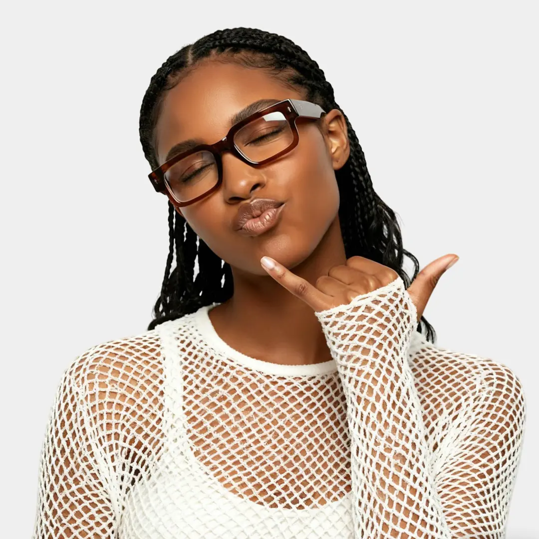 Front view of female wearing fashion brown rectangle eyeglasses, pouting, EP0542509