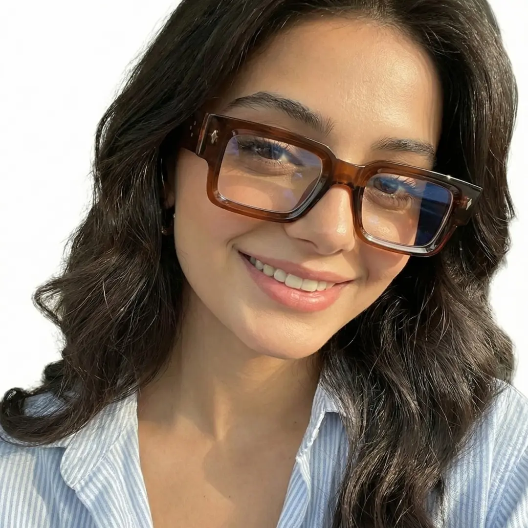 Three-quarter view of female wearing fashion brown rectangle eyeglasses, smiling, EP0542509