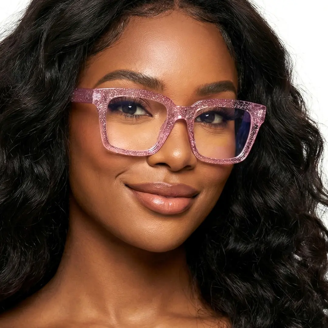 Three-quarter view of female wearing pink rectangle eyeglasses, natural smile, ER0032504
