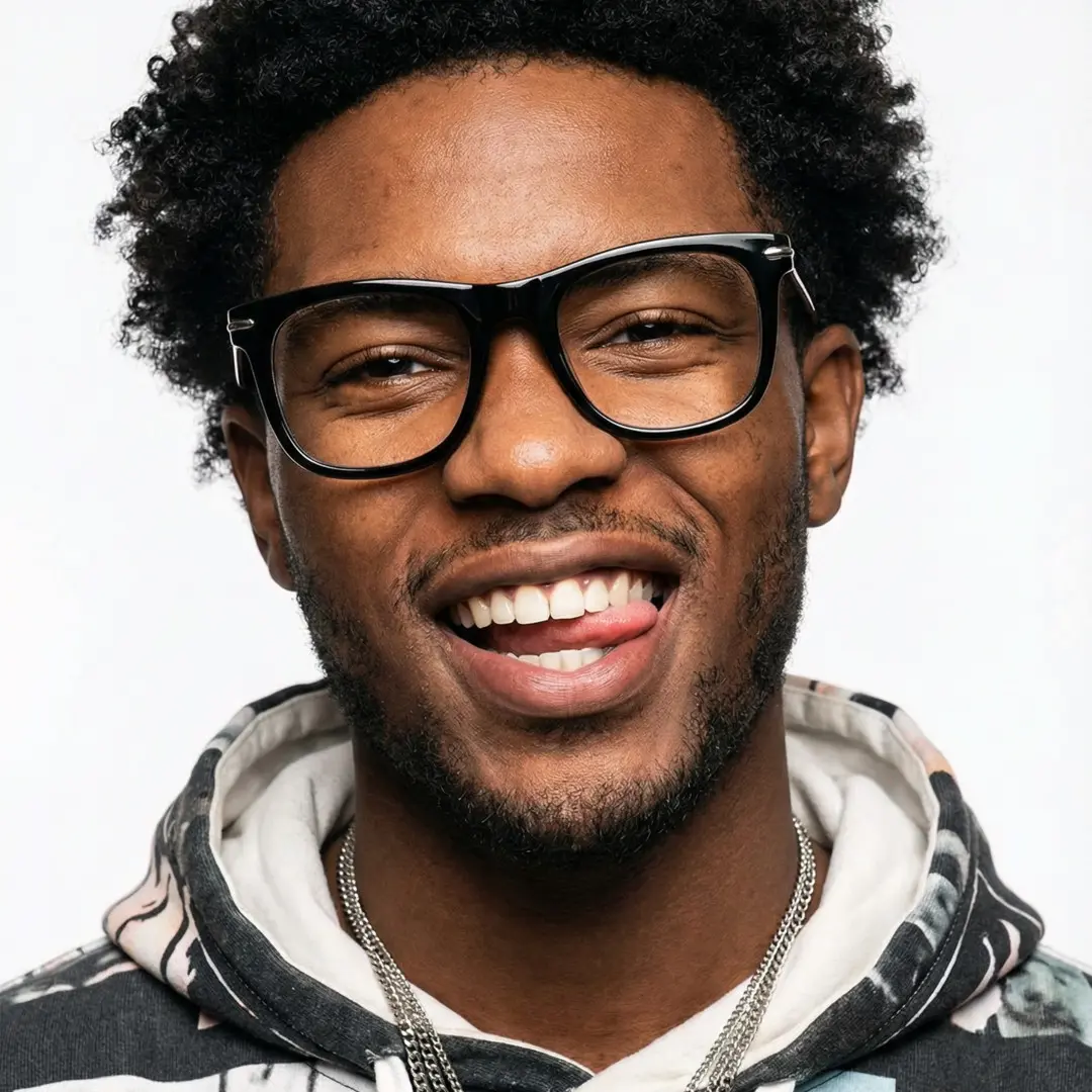 Front view of male wearing black rectangle eyeglasses, sticking out tongue, natural smile, ER0042510