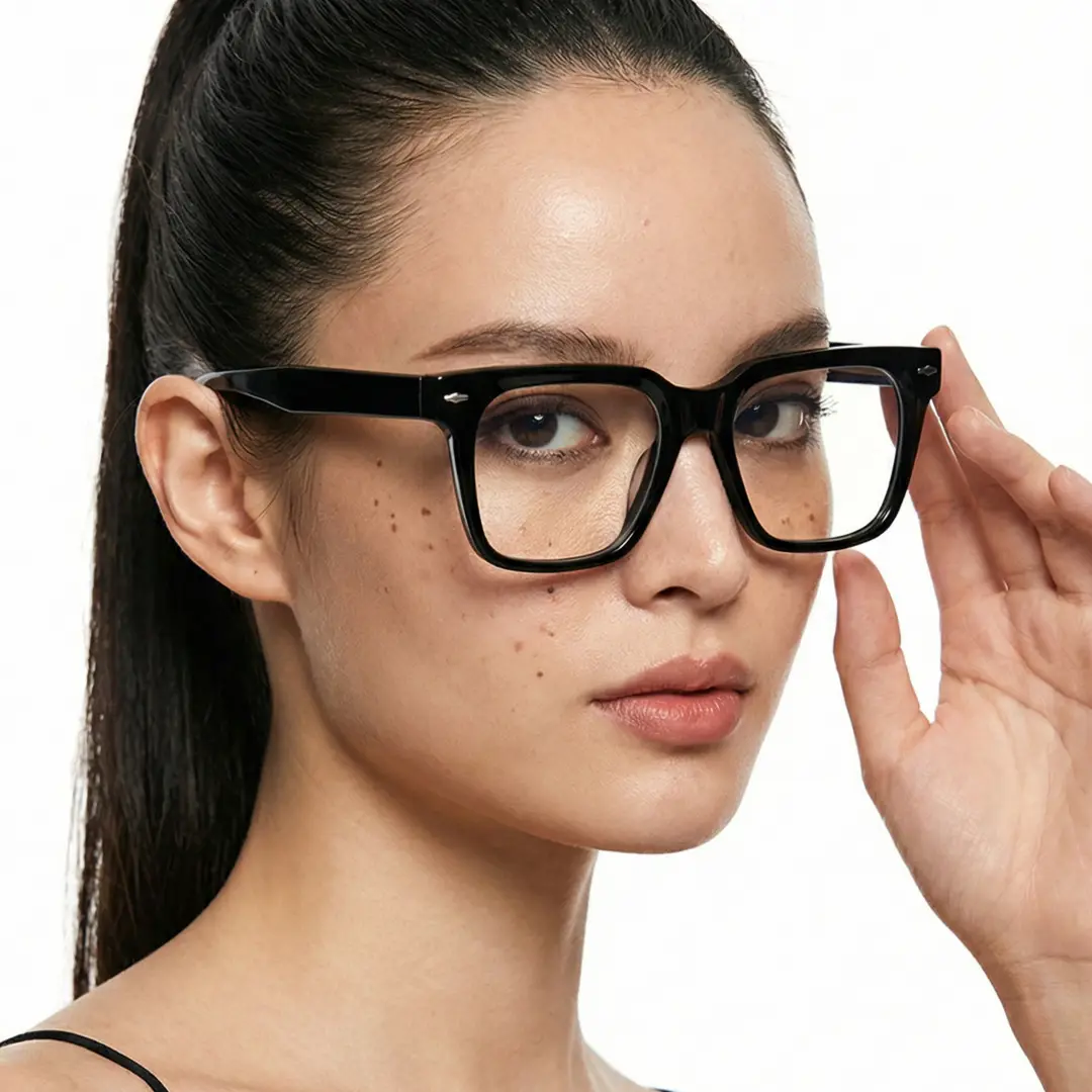 Over-the-shoulder view of female wearing black rectangle eyeglasses, adjusting glasses, neutral expression, ER0092508
