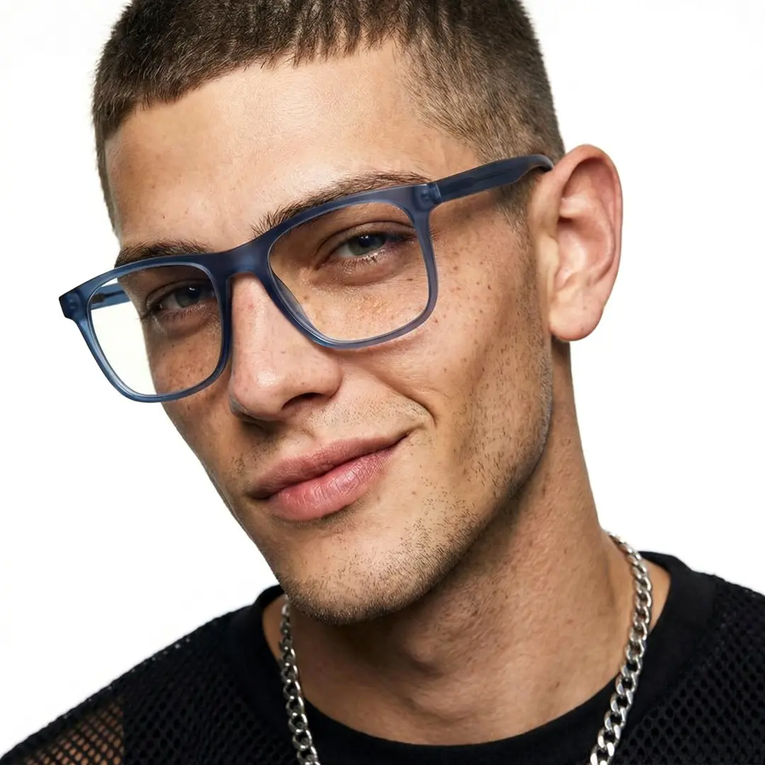 Tilted head view of male wearing blue rectangle eyeglasses, confident expression, ER0122508