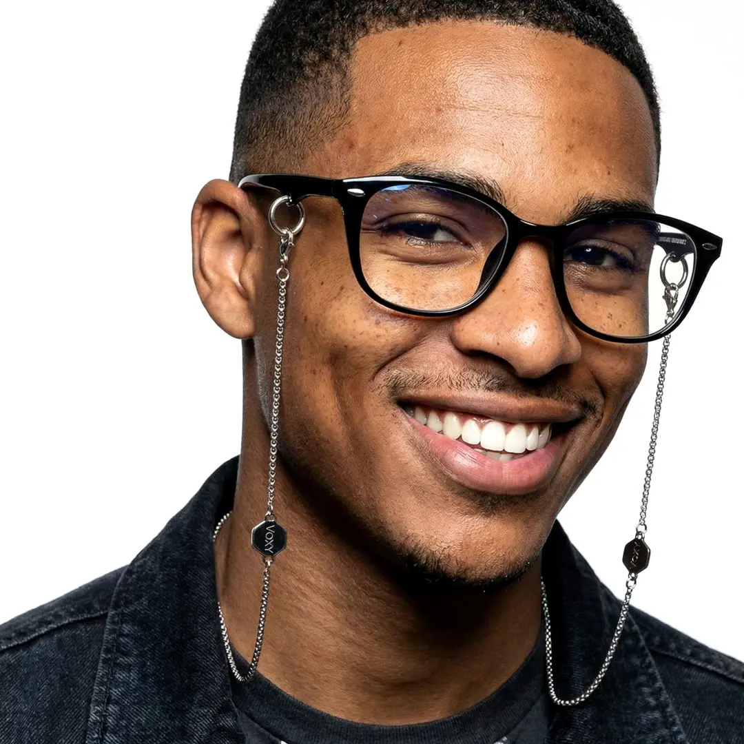 Face close-up view of male wearing fashion black rectangle eyeglasses, friendly smile, ER0212601