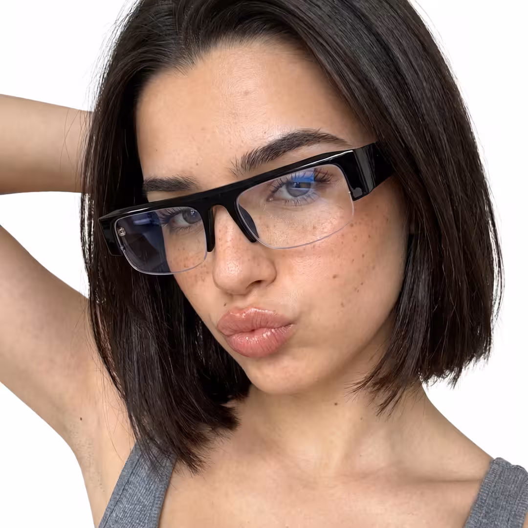 Three-quarter view of female wearing fashion black rectangle eyeglasses, pouting, ER0212604