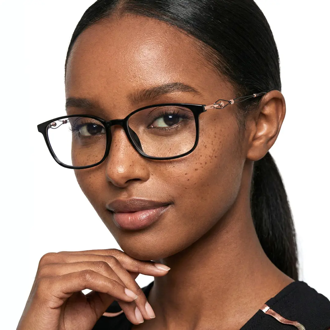 Profile view of female wearing office siren black rectangle eyeglasses, resting chin on hand, relaxed expression, ER0222509