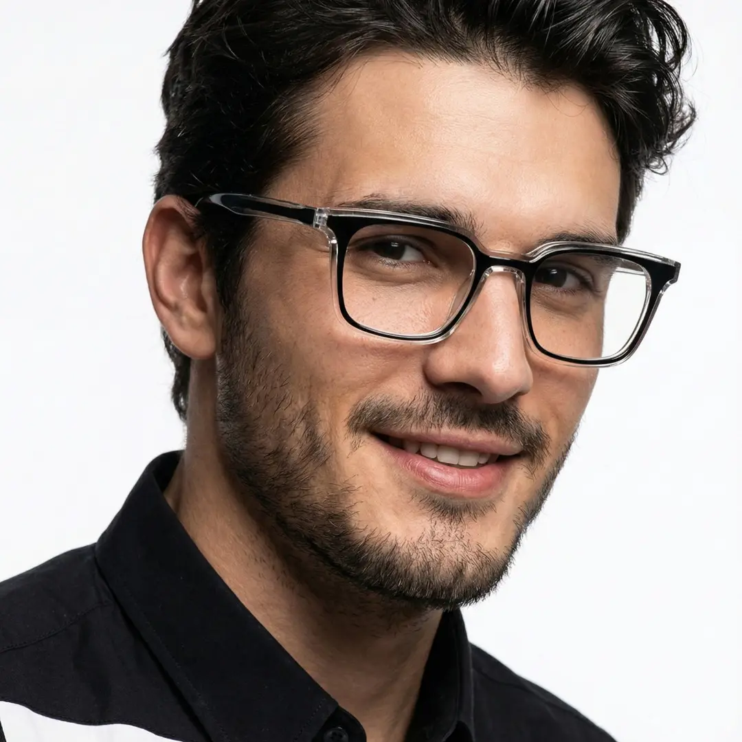 Face close-up view of male wearing black rectangle eyeglasses, soft smile, ER0232508