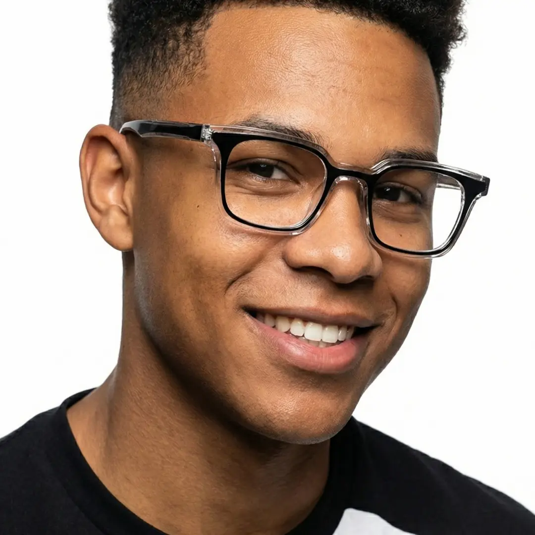 Three-quarter view of male wearing black rectangle eyeglasses, smiling, ER0232508