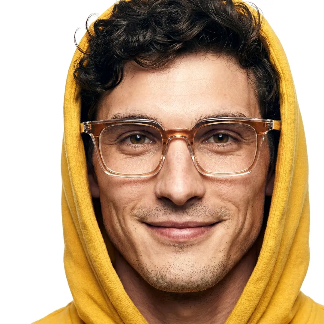 Front view of male wearing brown rectangle eyeglasses, soft smile, ER0232508