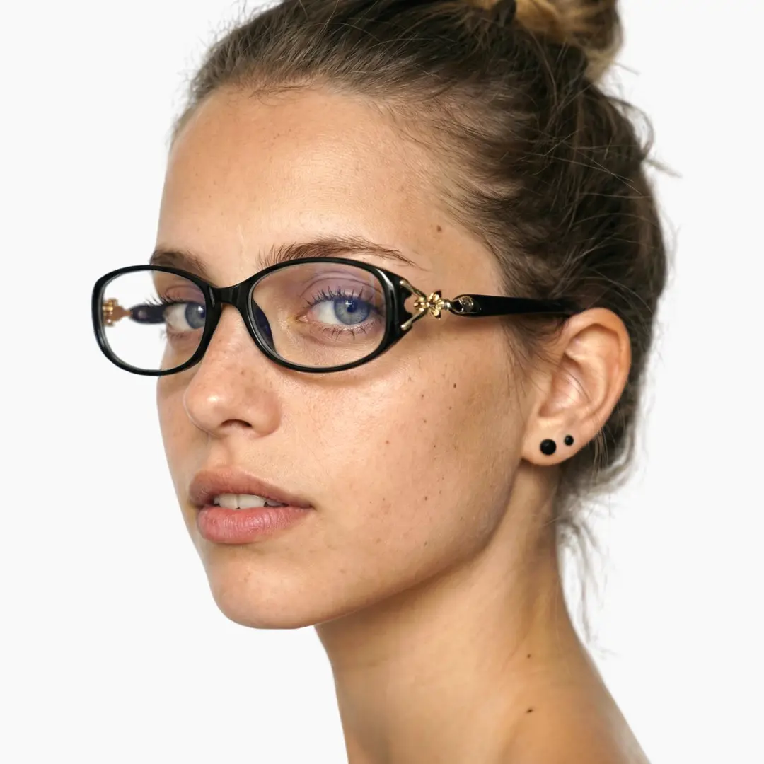 Over-the-shoulder view of female wearing office siren black rectangle eyeglasses, neutral expression, ER0442509