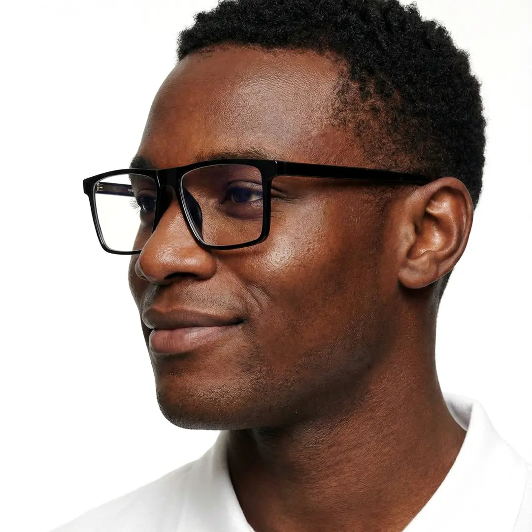 Looking away view of male wearing black rectangle eyeglasses, smiling, ER0452508