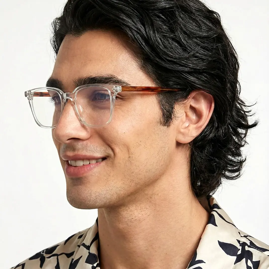 Profile view of male wearing clear rectangle eyeglasses, smiling, ER0462508