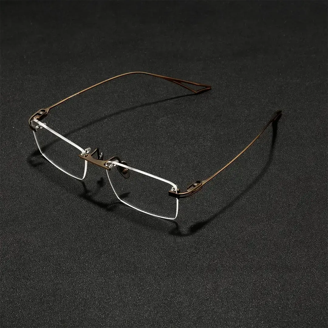 Scene close-up view of Dusk rectangle titanium eyeglasses ET0042604 in bronze
