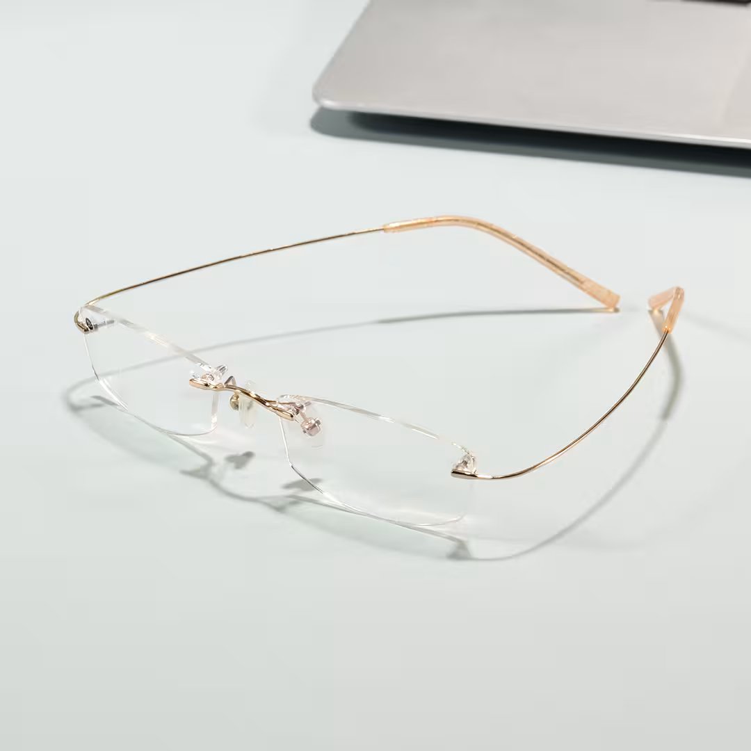 Scene view of Pyr rectangle titanium eyeglasses ET0242605 in gold