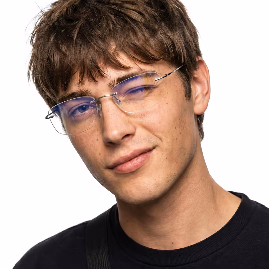 Front view of male wearing silver rectangle eyeglasses, winking, natural smile, ET0242605